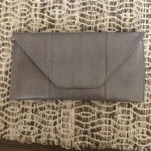 Grey snake skin appearance purse